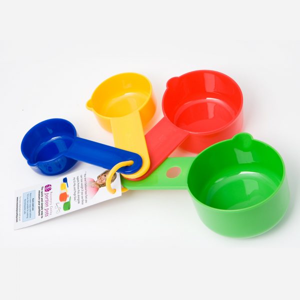 A set of Rosemary Conley Portion Pots. Four measuring cups in different sizes and colours to use with the instruction card explaining how many calories a portion of each foodstuff contaions