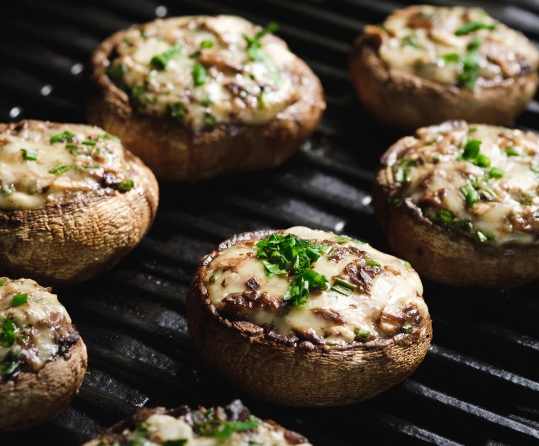 Stuffed mushrooms grilled with breadcrumbs, red onion and cheese.