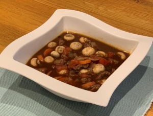Red Wine & Beef Casserole in a square white bowl