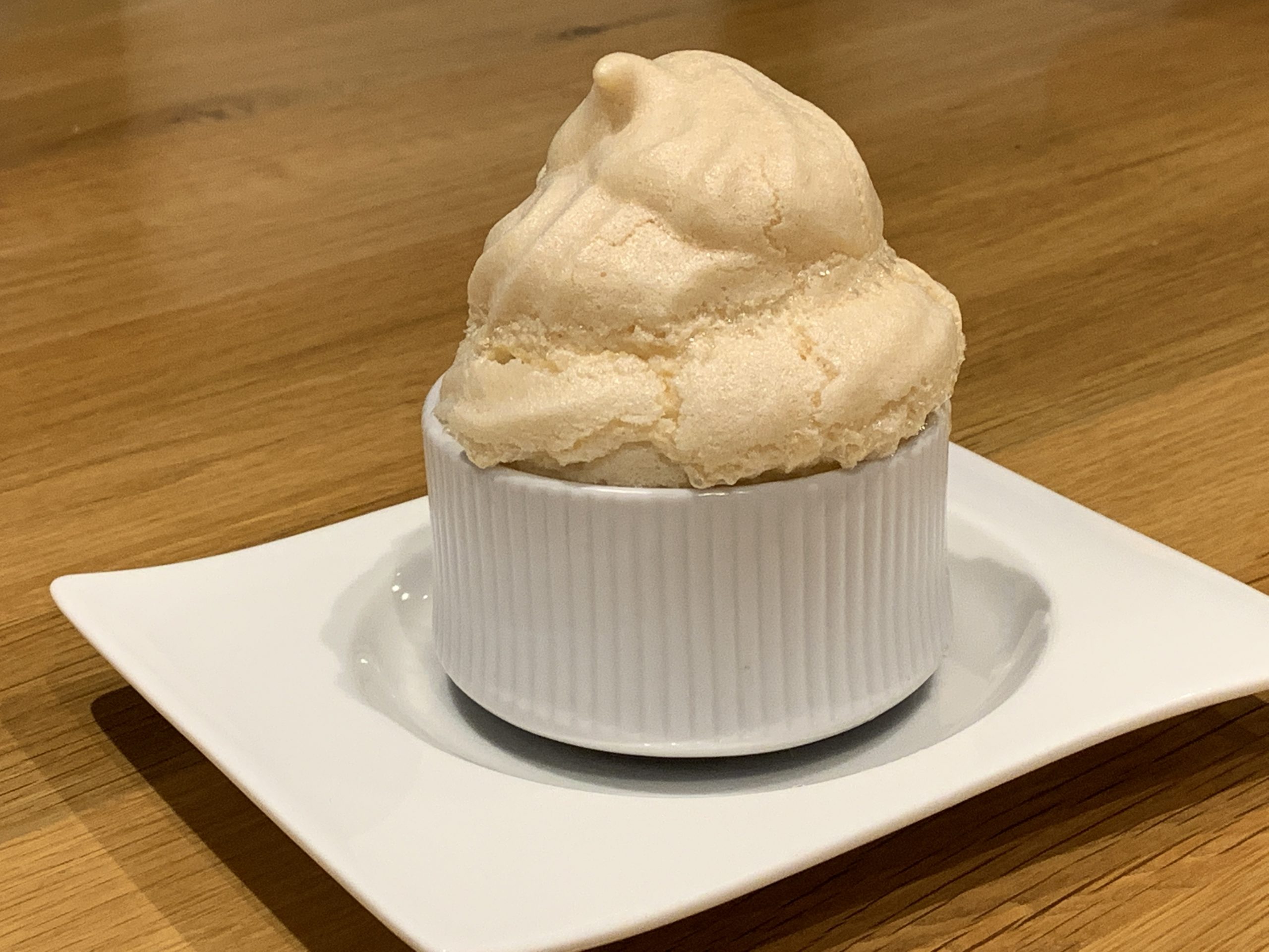 Queen of Puddings - A meringue topped dessert in an individual ramekin dish.