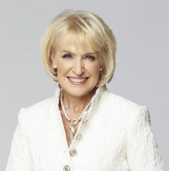 Head and shoulders shot of Rosemary Conley wearing a white jacket