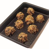 Chestnut stuffing balls on a baking tray