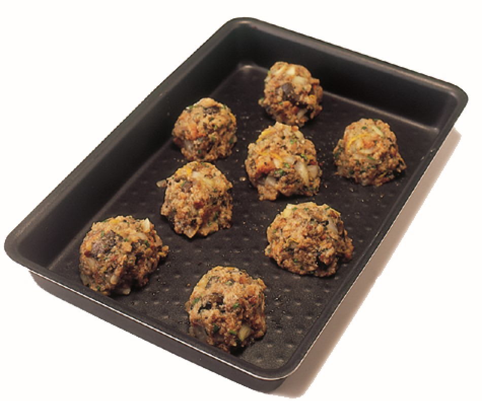Chestnut stuffing balls on a baking tray