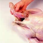 Wash the turkey well in cold water and remove the neck from the top of the bird and any excess fat.