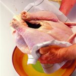 Rinse the turkey well under cold running water, allowing the water to flush through the bird.