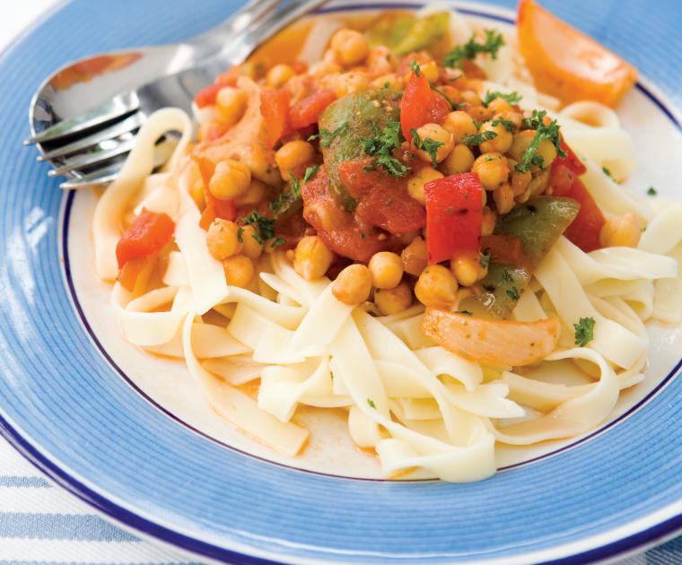 Roast Vegetable & Chickpea Pasta is a pasta dish topped with a tomato based sauce made with onion, garlic, cougettes, leek, peppers, chickpeas, pesto and soy sauce.