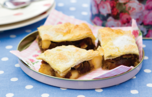 Date and Apple Slice is a tray bake of light puff pastry filled with a paste mixed from cooked apples and dates.