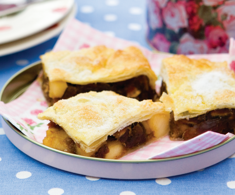 Date and Apple Slice is a tray bake of light puff pastry filled with a paste mixed from cooked apples and dates.