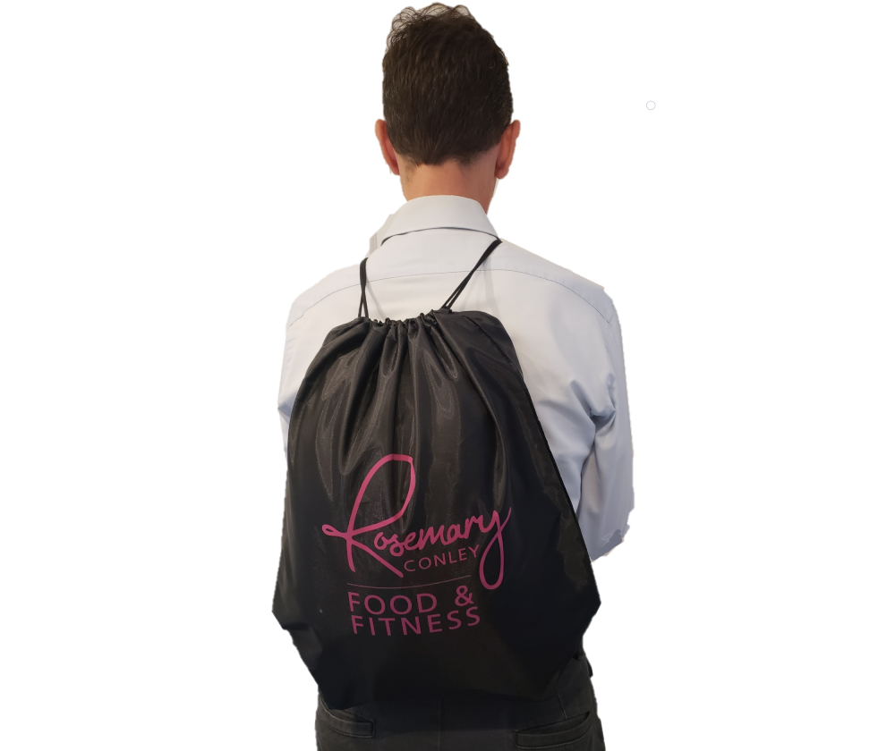 Black draw string Rosemary Conley Food & Fitness Gym Bag with pink logo. Shown being worn as a backback over the shoulders