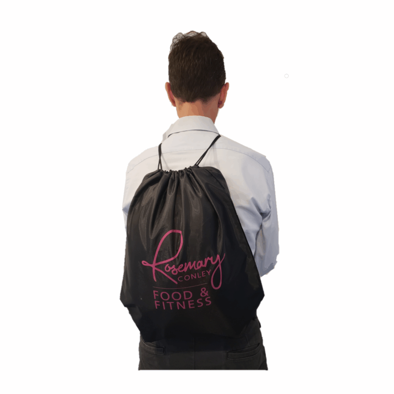 Black draw string Rosemary Conley Food & Fitness Gym Bag with pink logo. Shown being worn as a backback over the shoulders