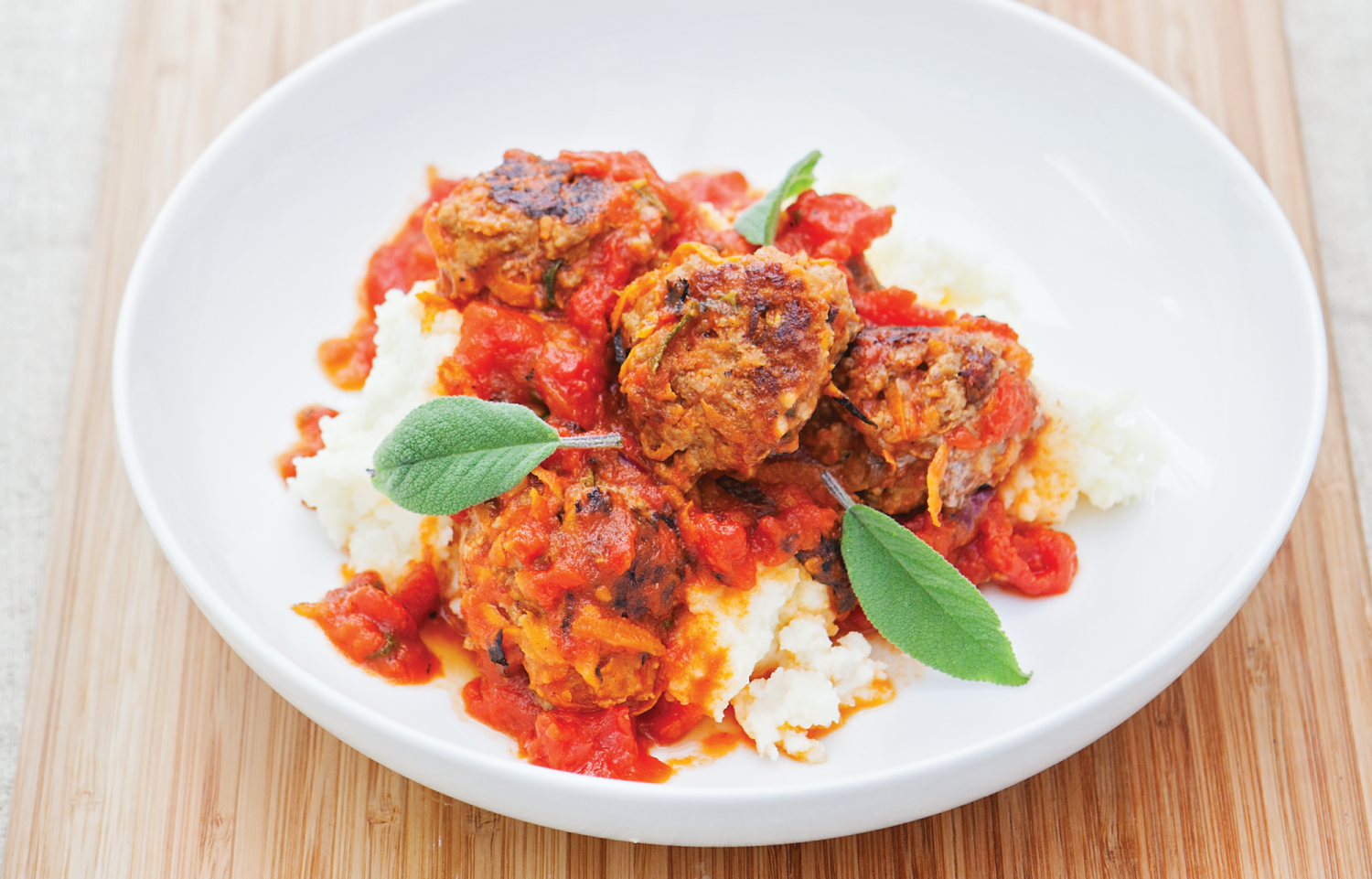 Pork, Carrot and Sage Meatballs are golfball sized meatballs made with added grated vegetables so they contain less meat. The recipe also includes a tasty sauce made with tomatoes, garlic and honey.
